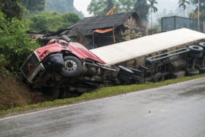 Red semi-truck overturned in a ditch